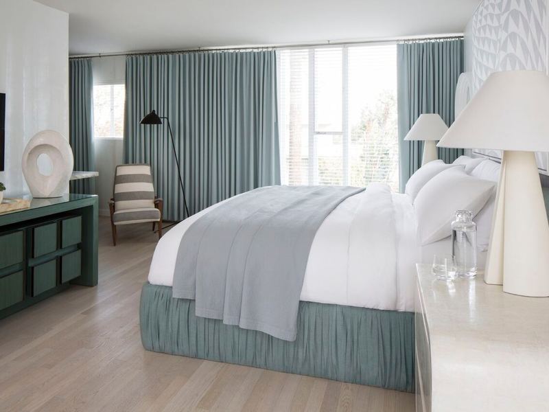 Guest room with custom drapery and joinery