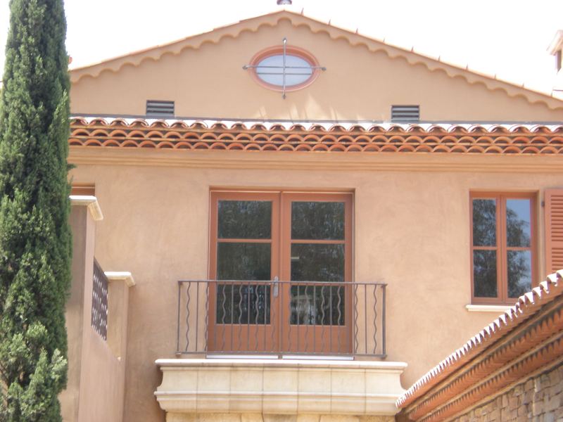 Spanish revival facade with new windows