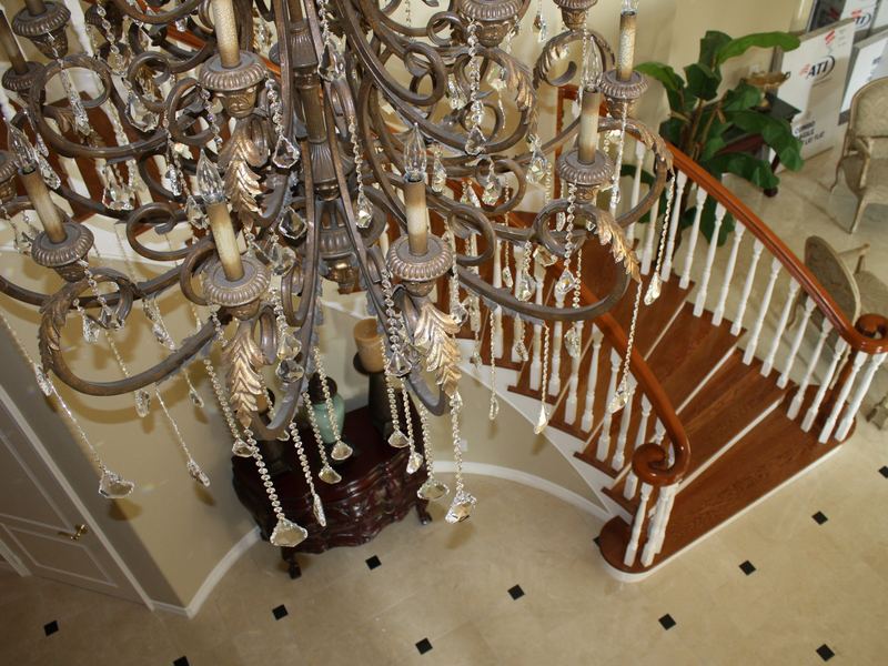 Stair detail beneath a crystal chandelier