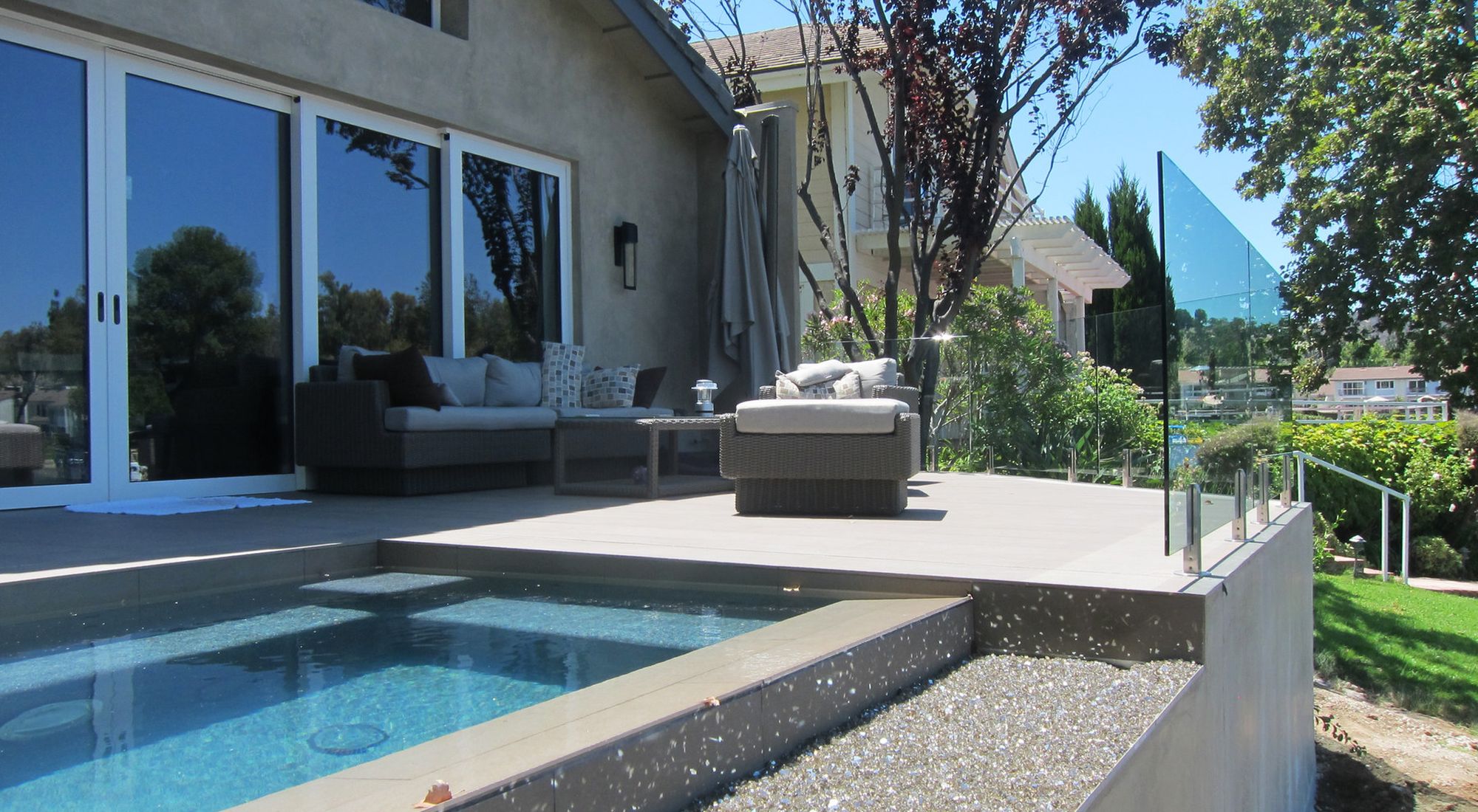 Contemporary hillside home with pool built by BBSC