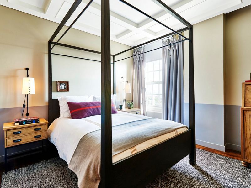 Hotel bedroom with custom millwork and drapery