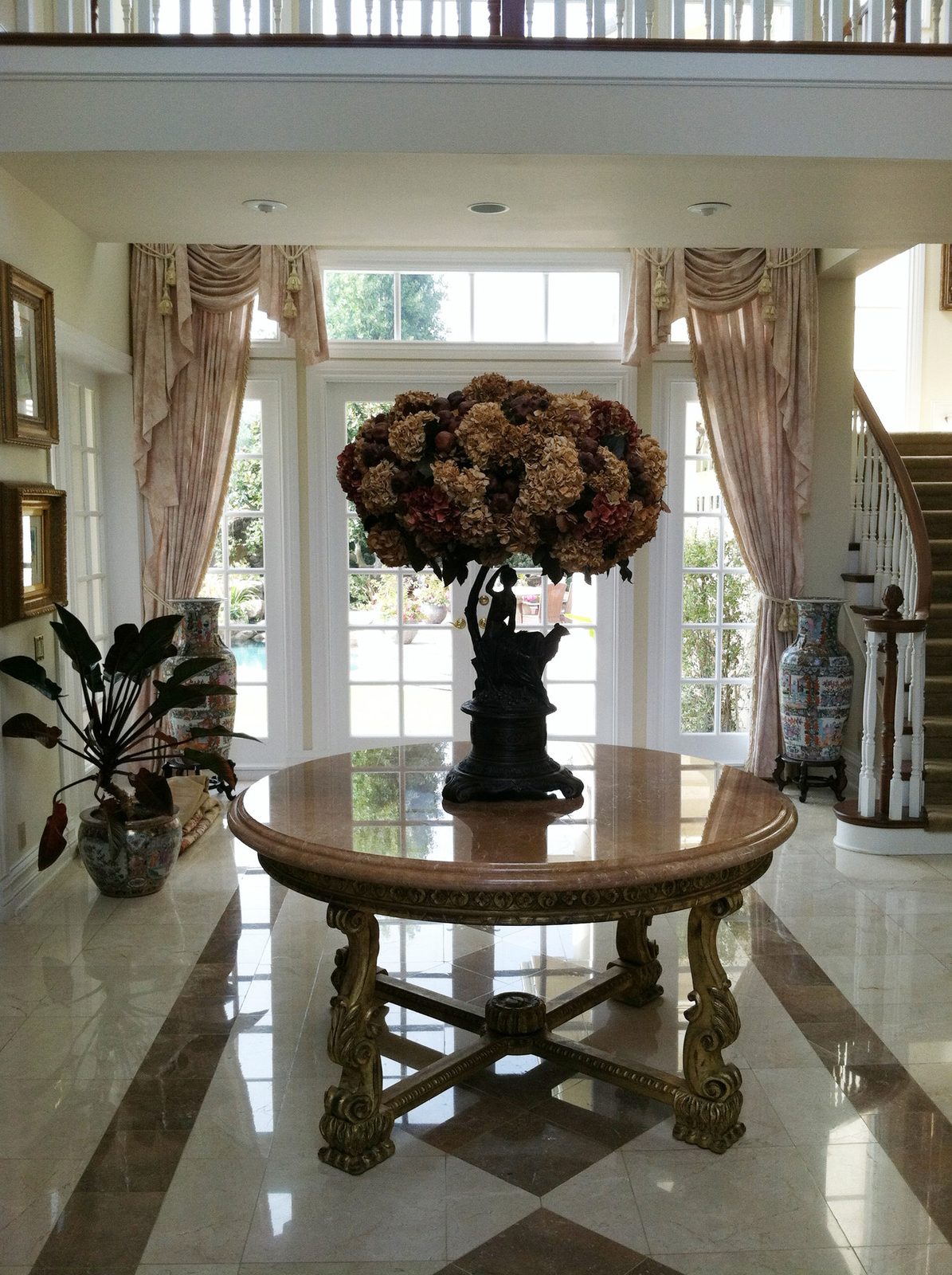 Marble entry foyer with custom moldings by BBSC